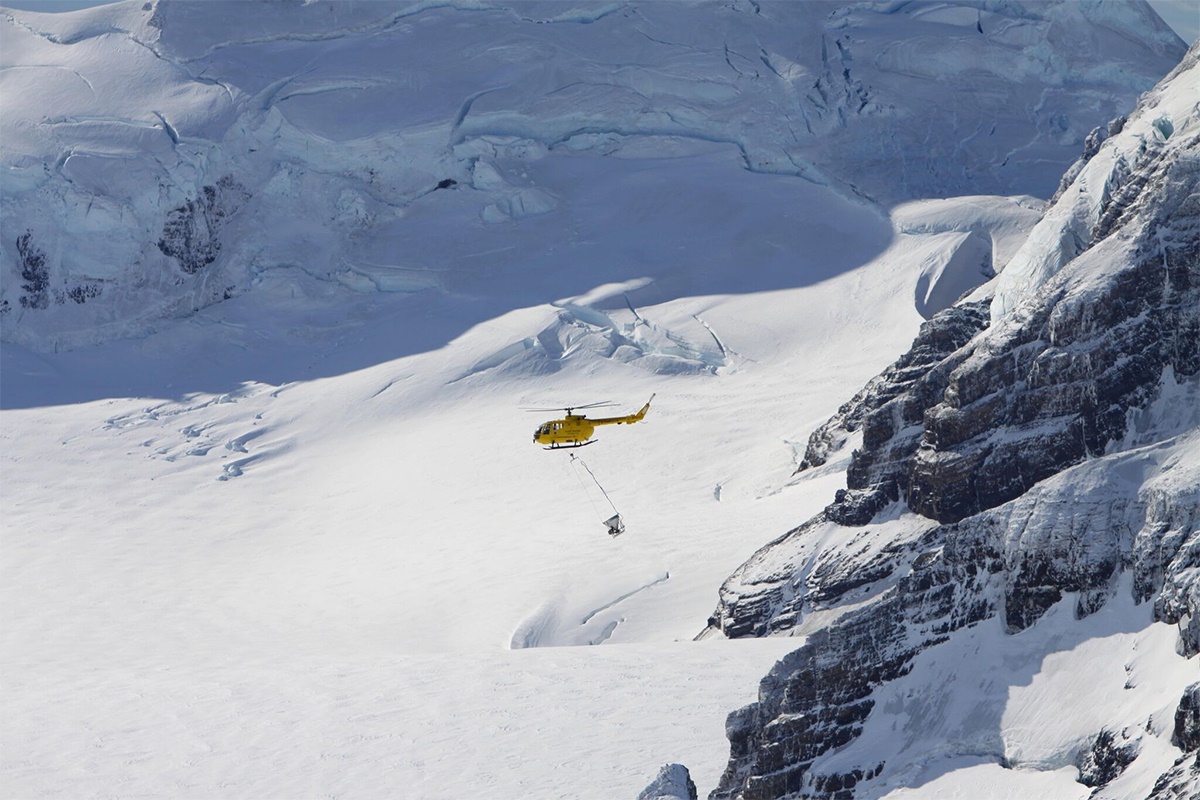 Phase I. Helicopter over icecap close up credit Tony Martin Phase I. Helicopter over icecap close. Credit - Tony Martin